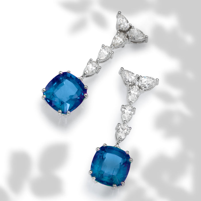 custom made earrings , diamonds and gems.